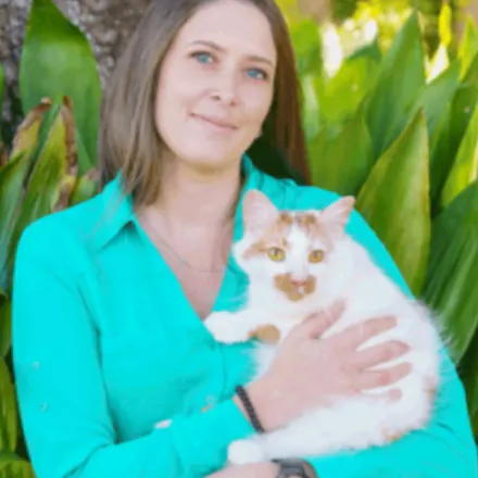 Candice Galella holding a white and orange cat